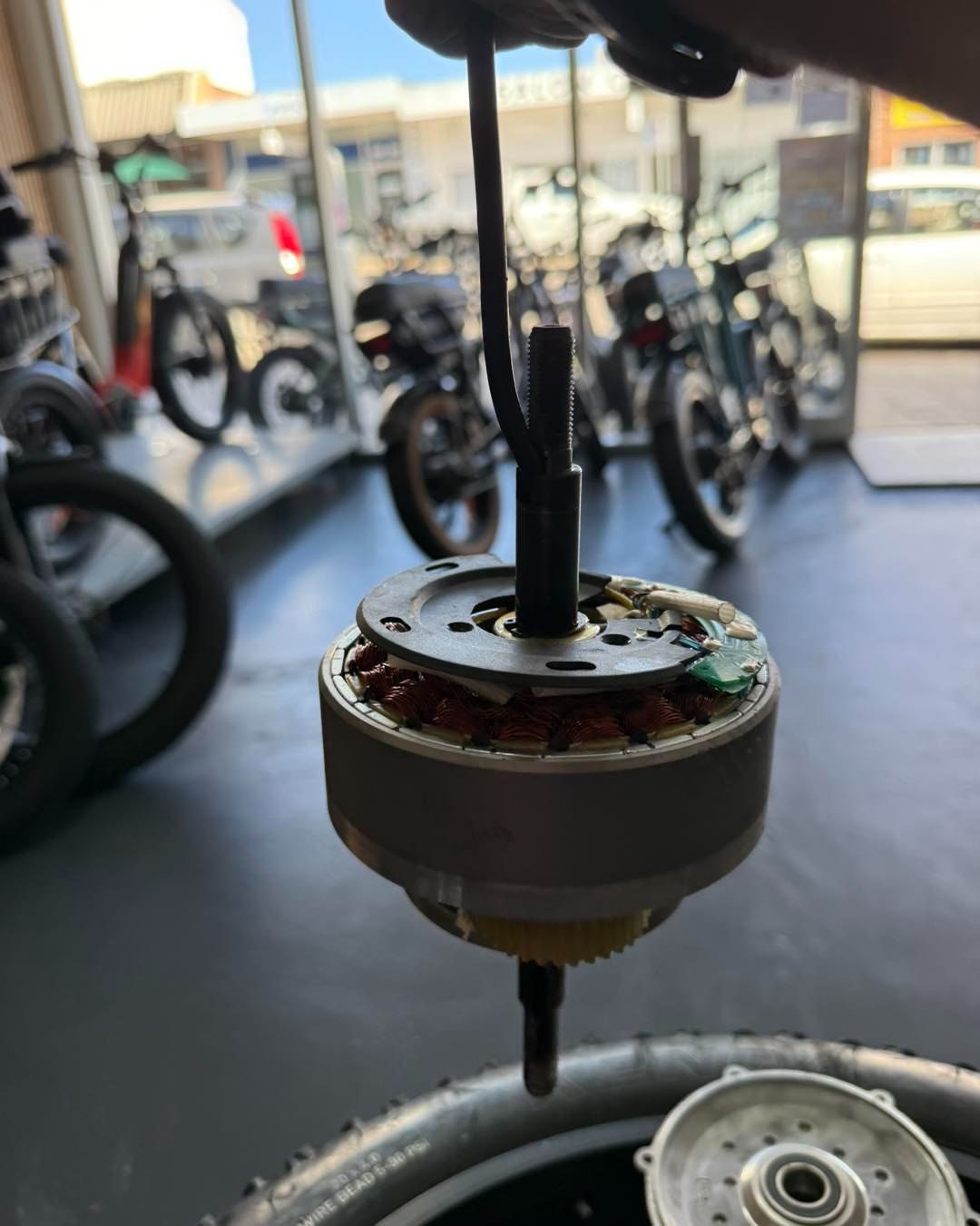 Electric Bike Motor Being Held, Shows Internal Components — E-Go-Try-Bikes in Nelson Bay, NSW