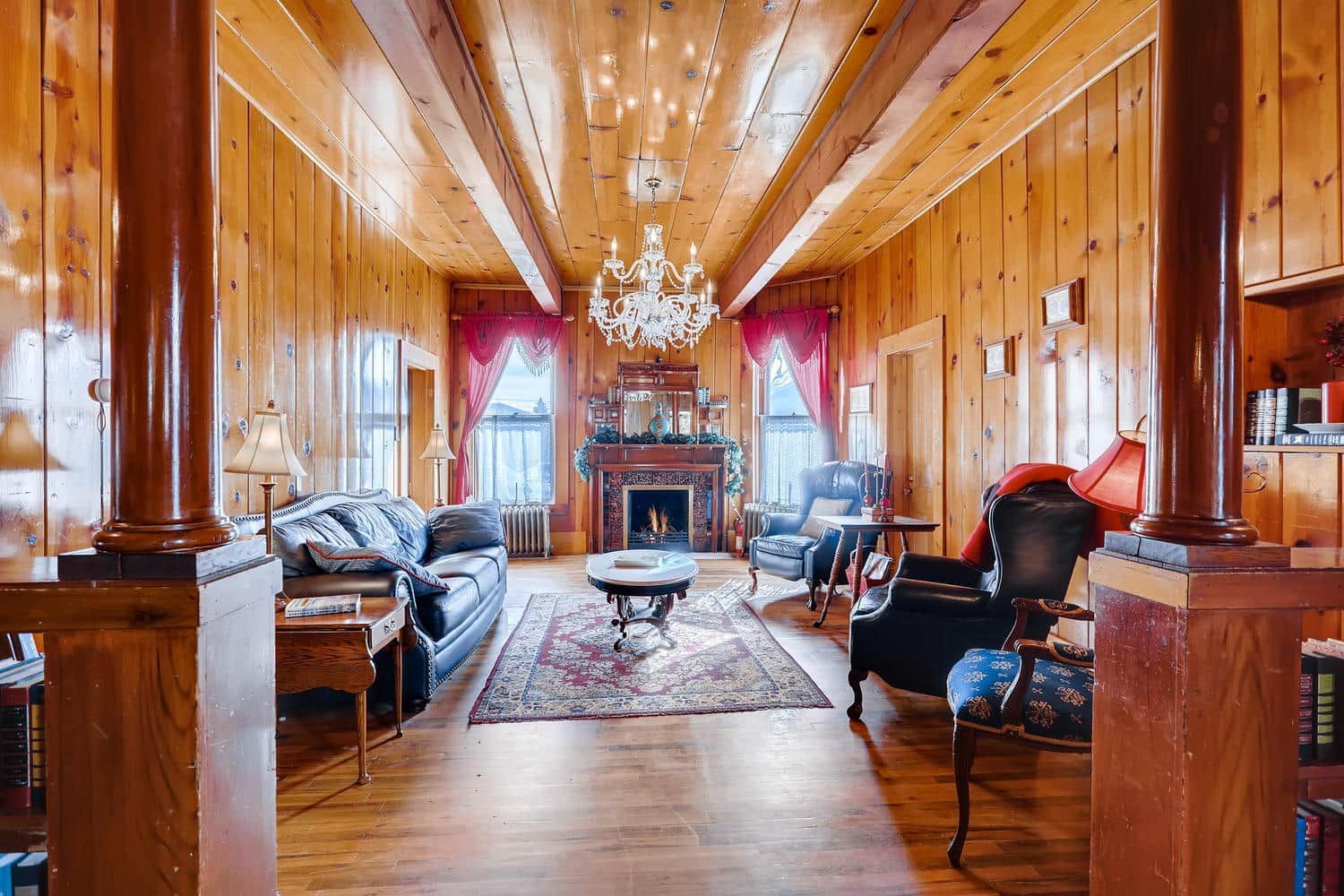 A living room filled with furniture and a fireplace.