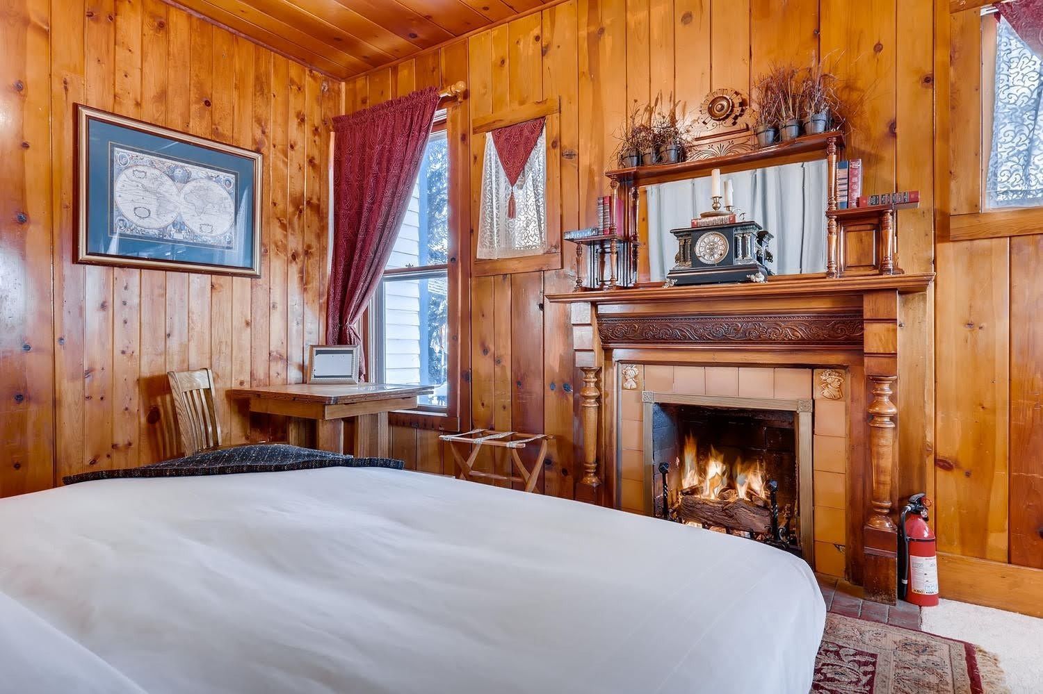 There is a fireplace in the middle of the room.