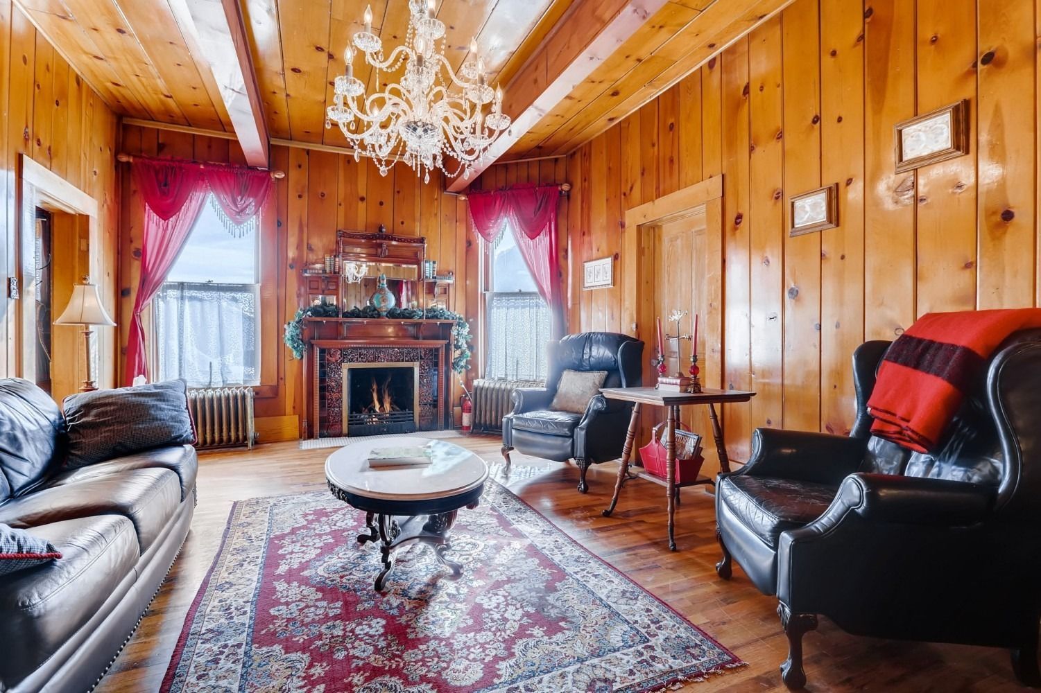 A living room filled with furniture and a fireplace.