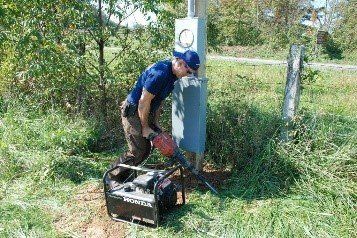 Man Using a Hand Drill — Natural Bridge Station, VA — Roscher Electric