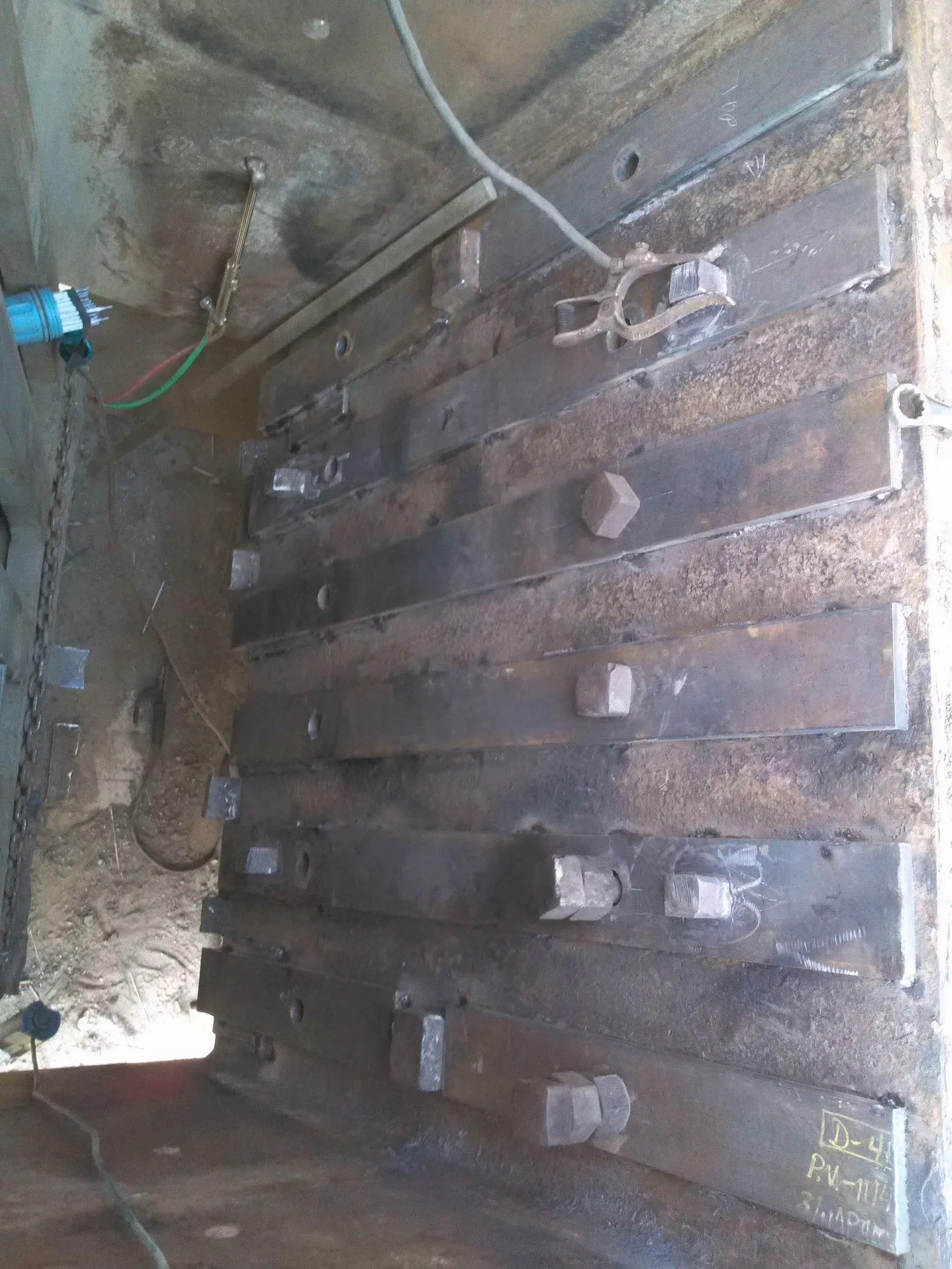 A bunch of metal pieces are sitting on top of each other in a room.