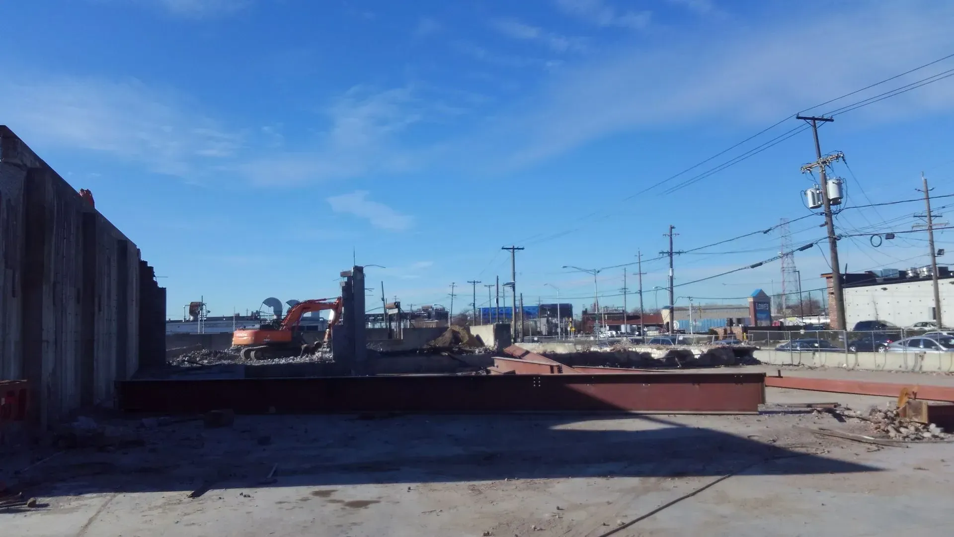A large building is being demolished in a city.