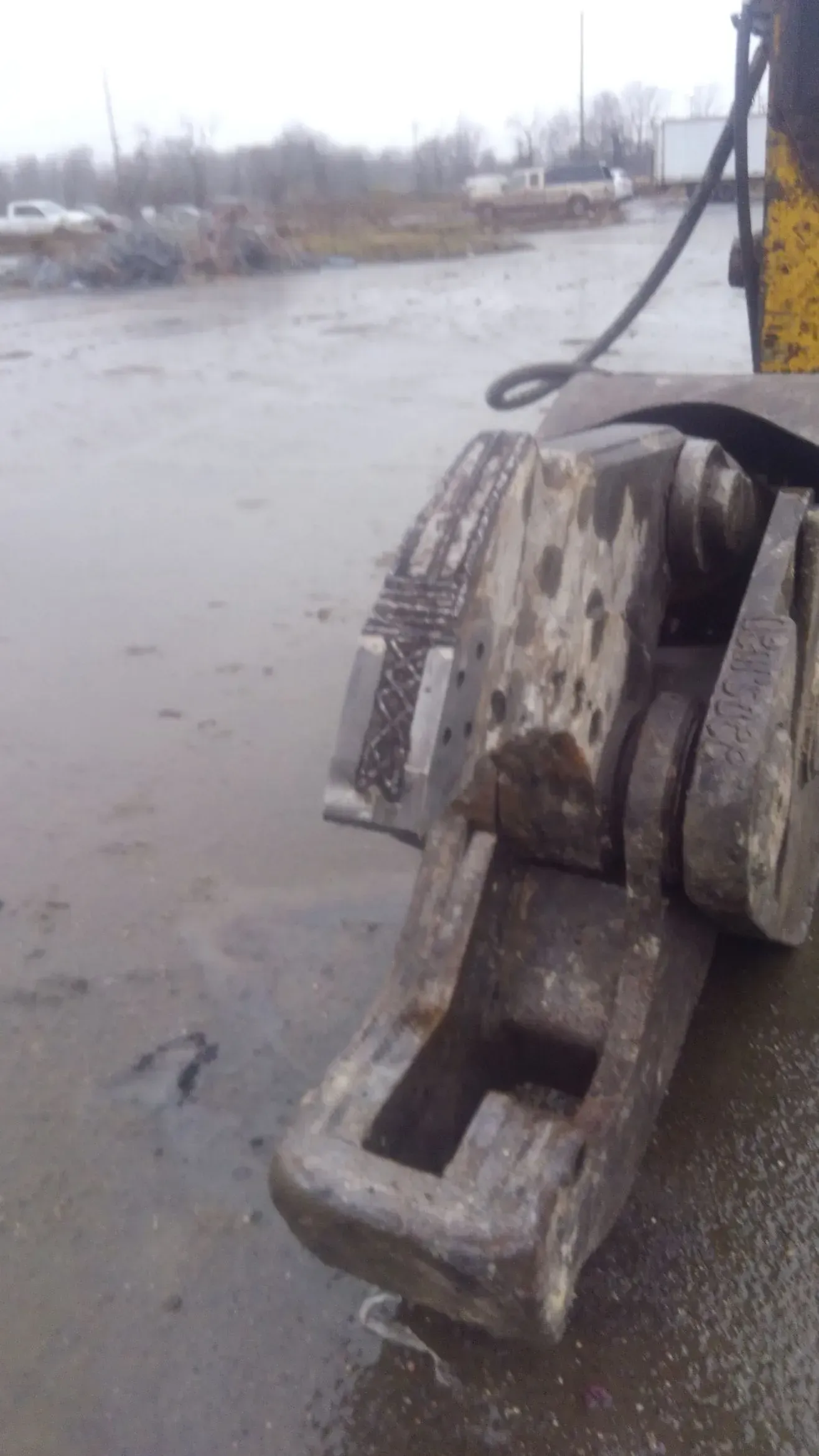 A close up of a piece of metal on a concrete surface.