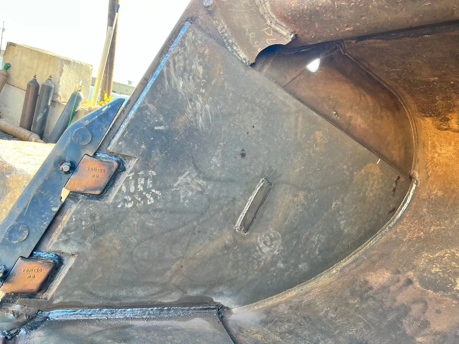 A close up of a piece of metal with a hole in it.