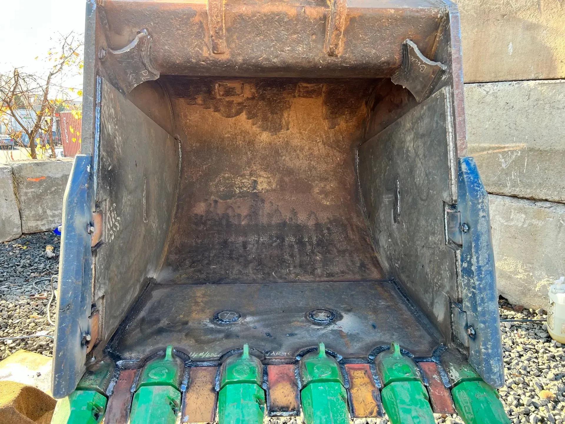 The inside of a bucket of a bulldozer is shown.