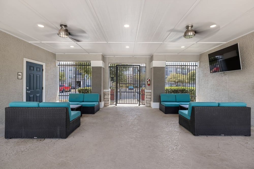 Expansive sundeck with a lot of furniture and a ceiling fan at Marquis at The RIM in Northwest San Antonio, TX.