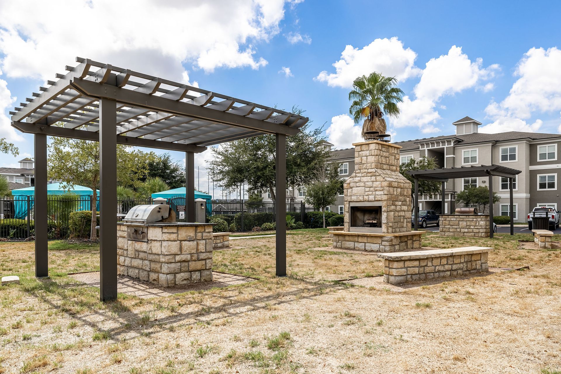 Outdoor grill and a fireplace at Marquis at The RIM in Northwest San Antonio, TX.
