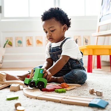 Little Boy Playing with a Toy Train — Jackson, MS — Capital City Children & Adolescent Clinic, PLLC