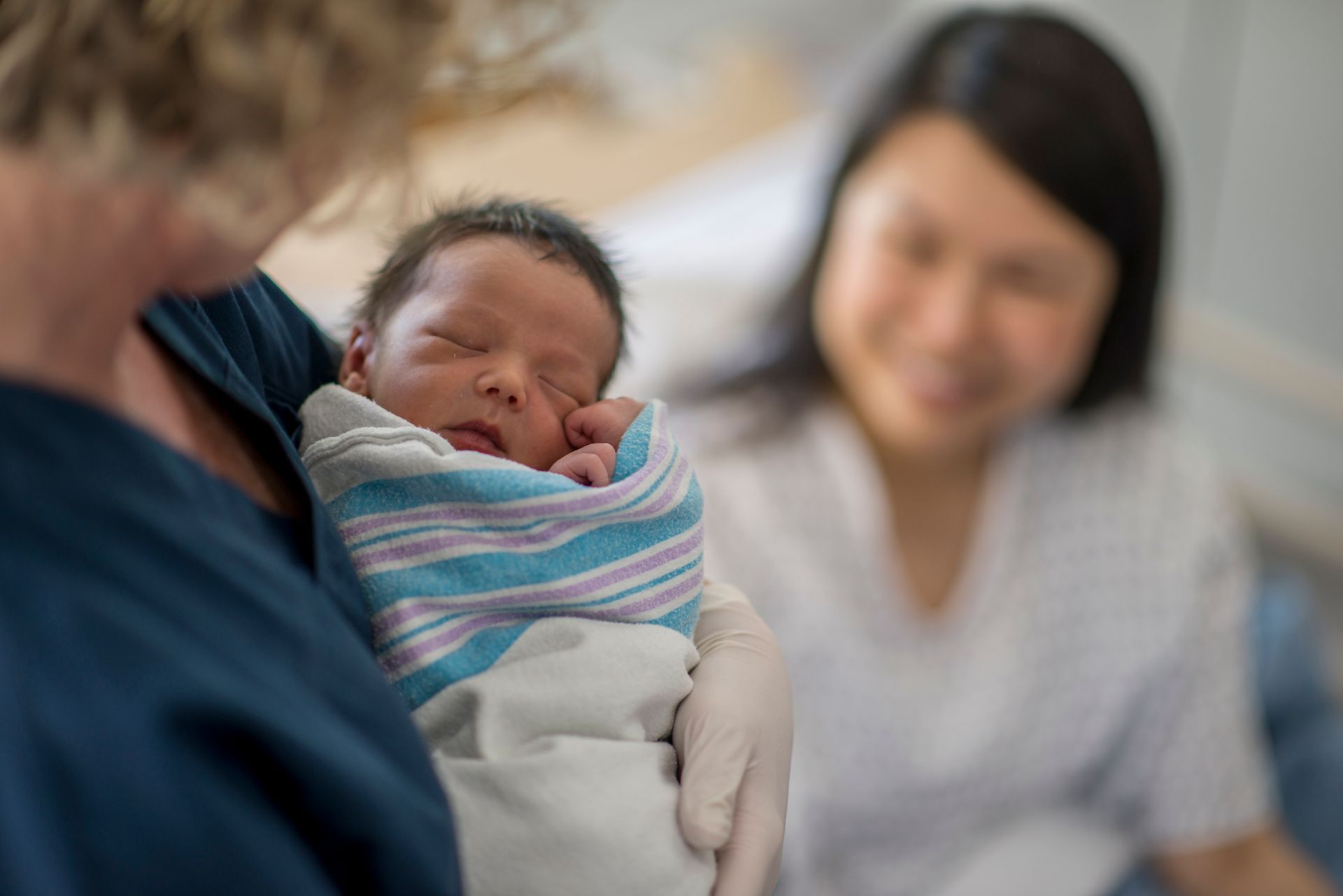 Nurse Holding Baby — Brandon, MS — Capital City Children & Adolescent Clinic, PLLC