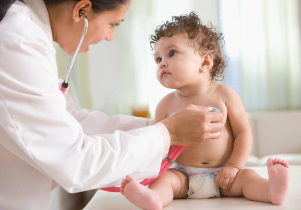 Doctor Examining Baby Girl — Madison, MS — Capital City Children & Adolescent Clinic, PLLC