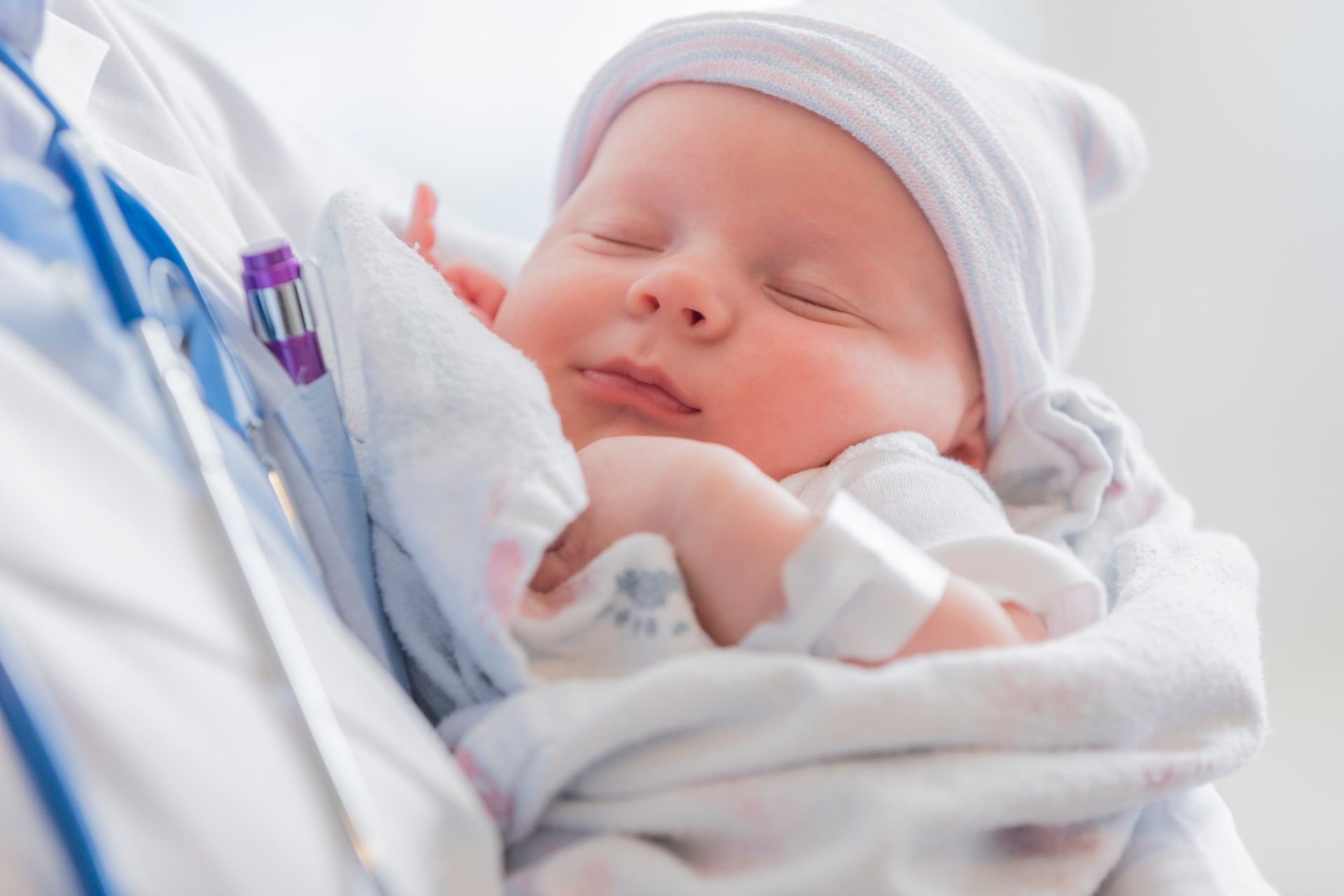 Sweet Infant Sleeps in Doctor's Arms — Brandon, MS — Capital City Children & Adolescent Clinic, PLLC