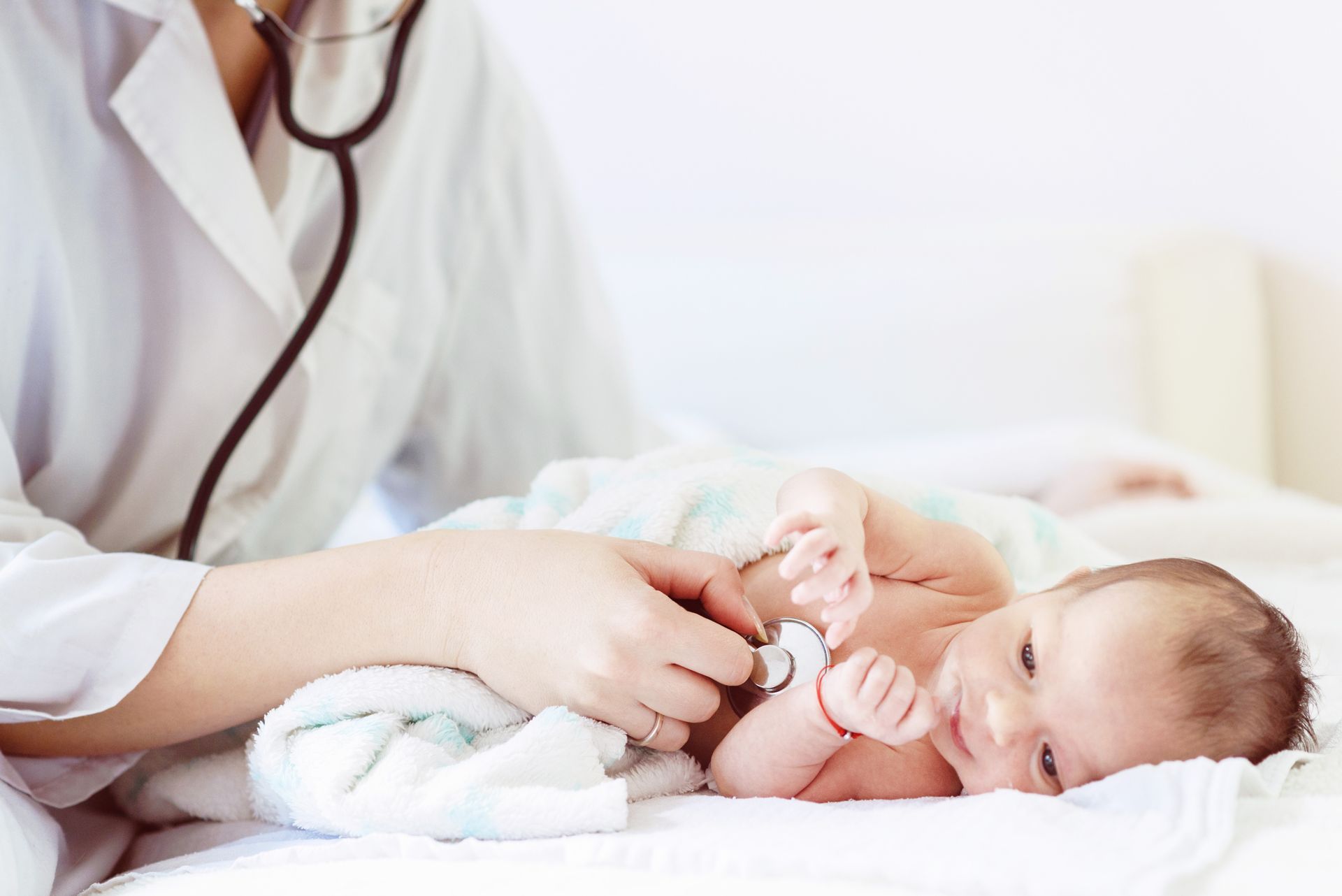 Female Doctor Examines Infant with Stethoscope — Jackson, MS — Capital City Children & Adolescent Clinic, PLLC