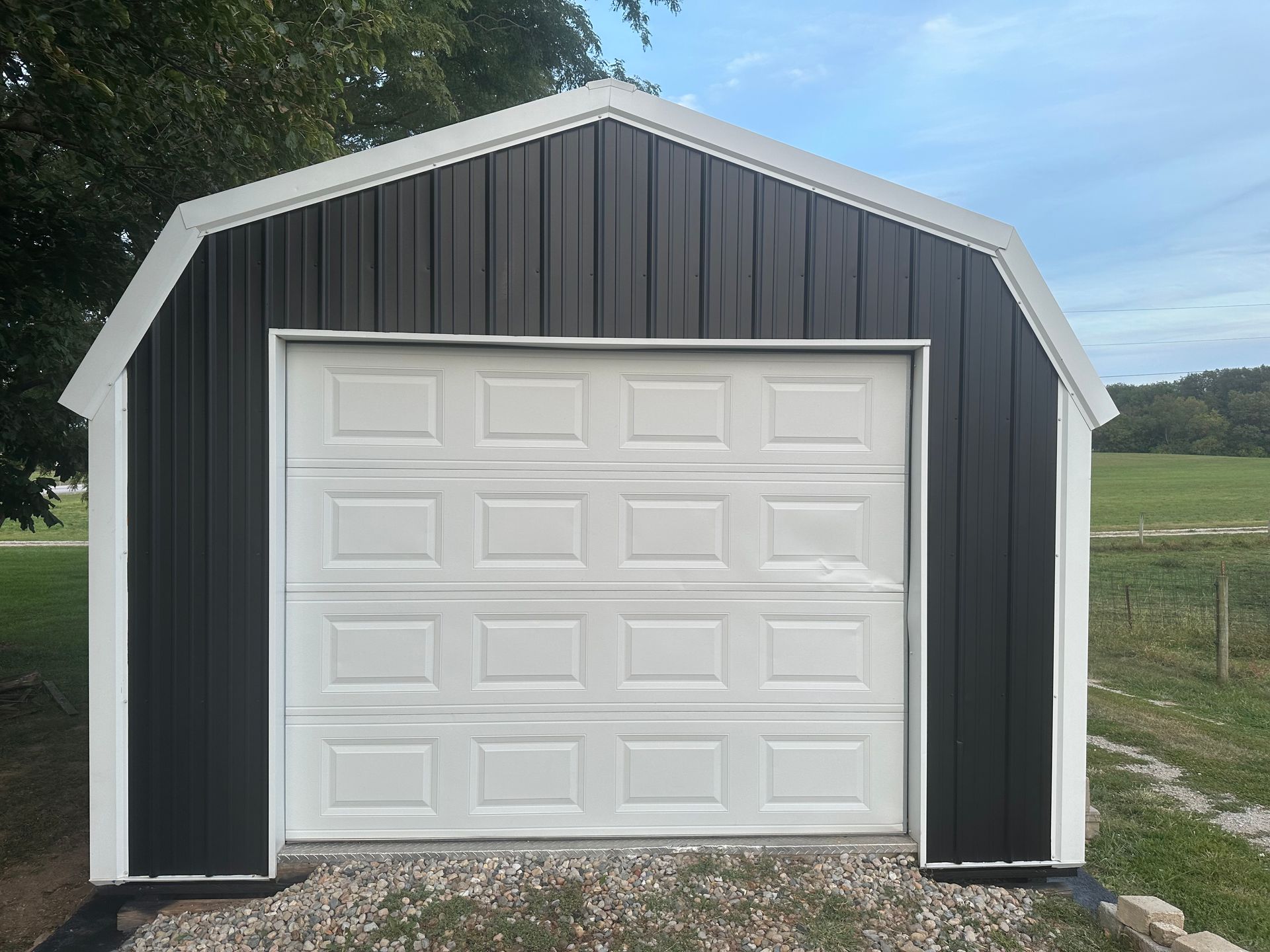 A close up of a sidewalk next to a garage door.