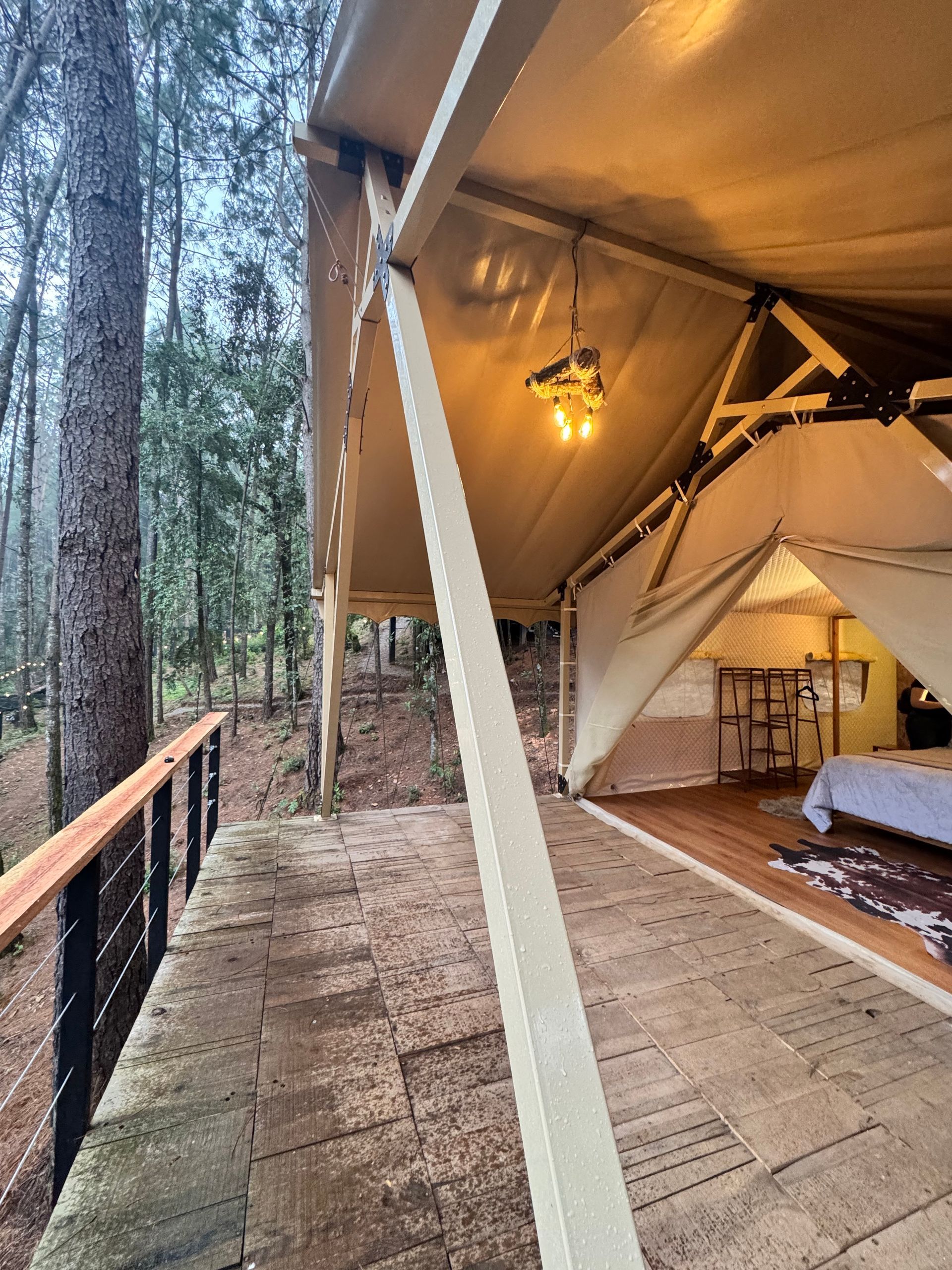 A sunset over a mountain range with a lot of fog