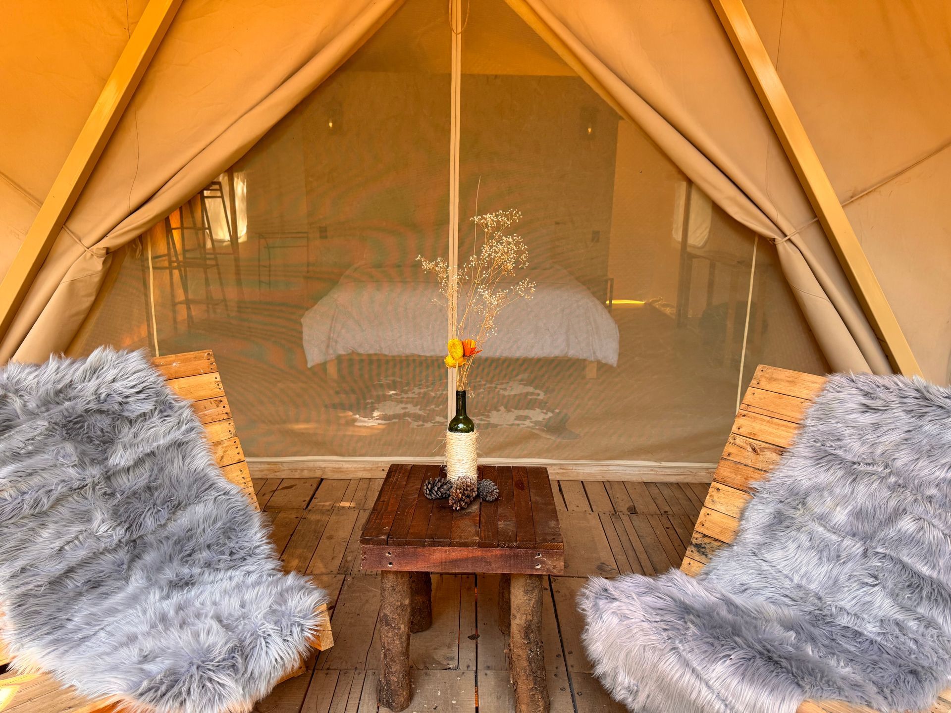 A sunset over a mountain range with a lot of fog