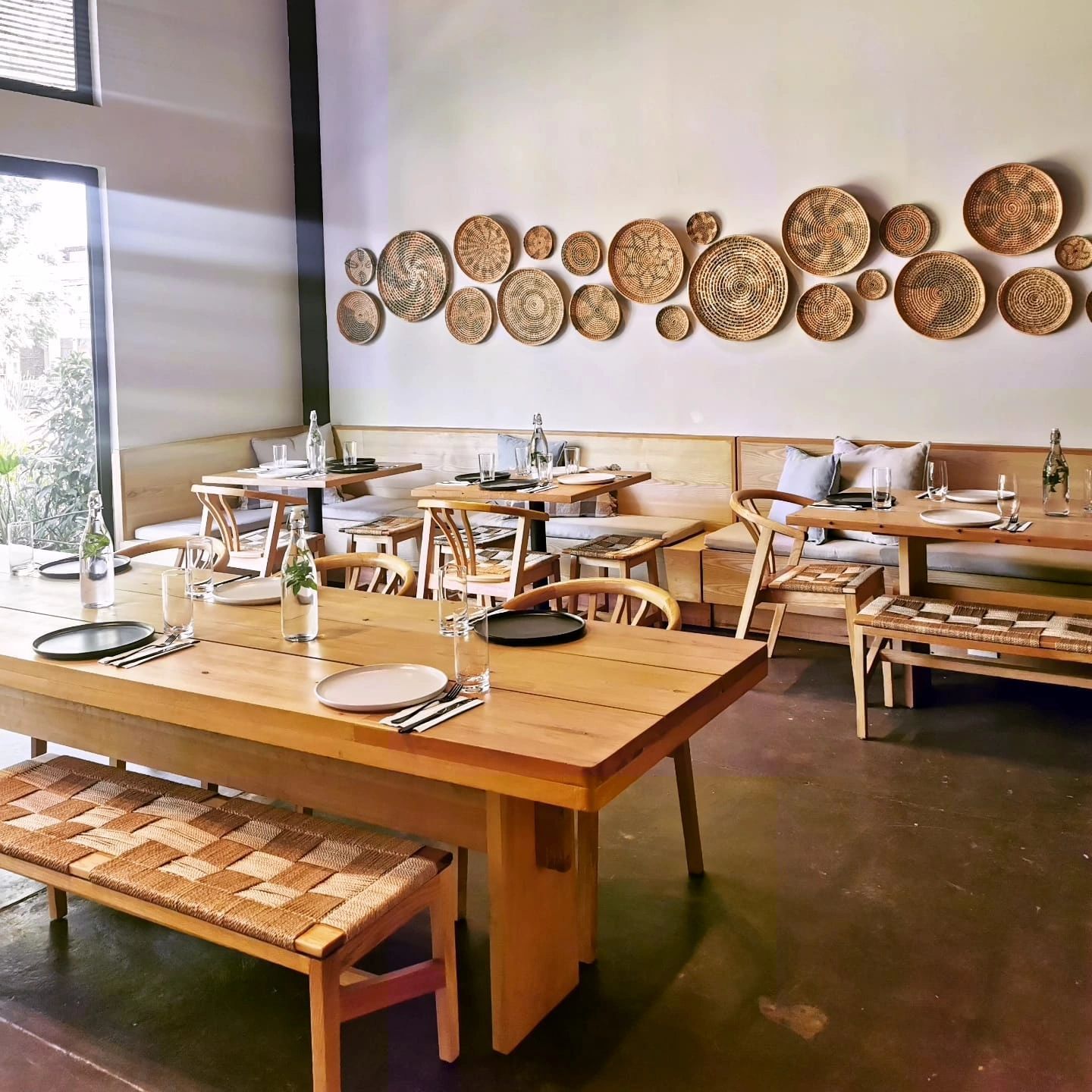 A sunset over a mountain range with a lot of fog