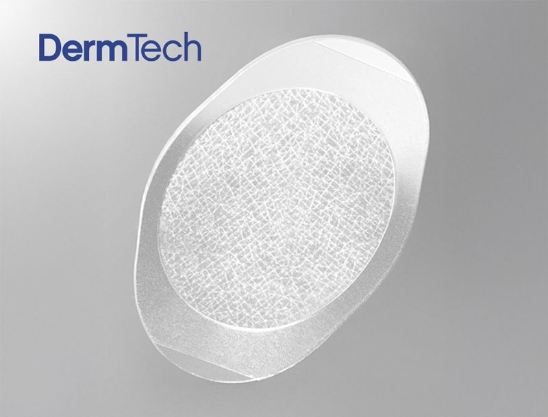 DermTech skin patch: transparent oval with central textured area, for medical use.