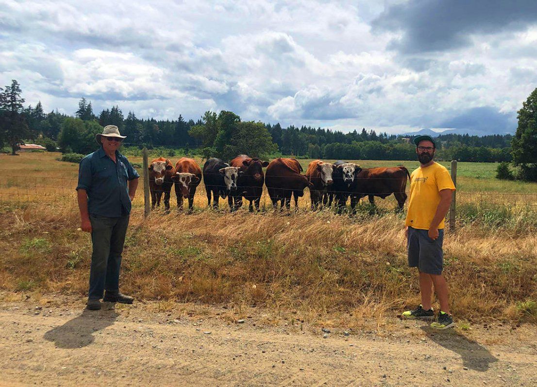 Edgar Smith (left), owner and operator of Beaver Meadow Farms and Dr. Spencer Serin (right) at Beaver Meadow Farms in Comox.