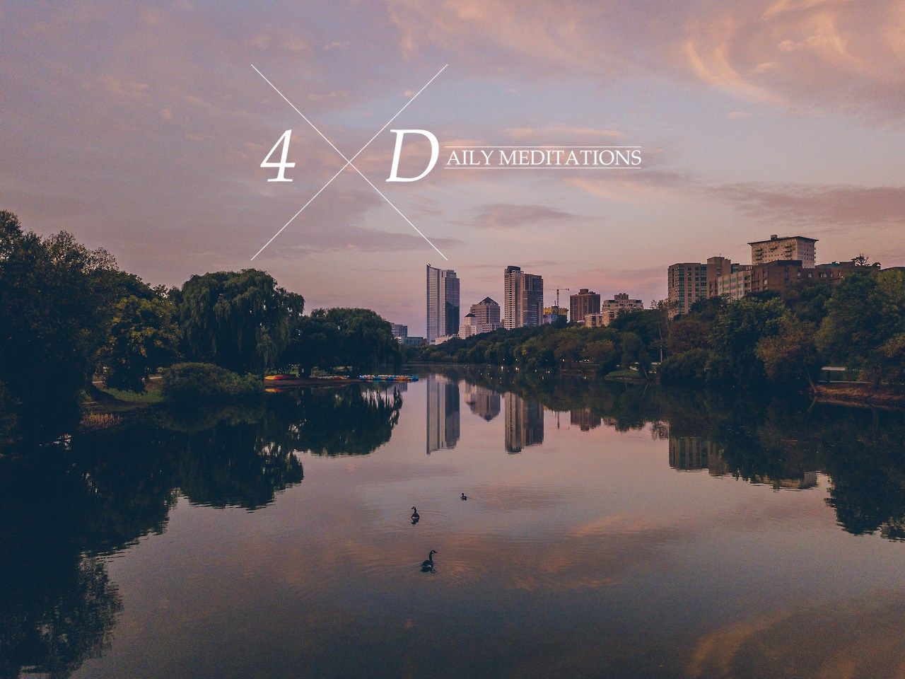 Calm river reflecting cityscape at sunset, with text 