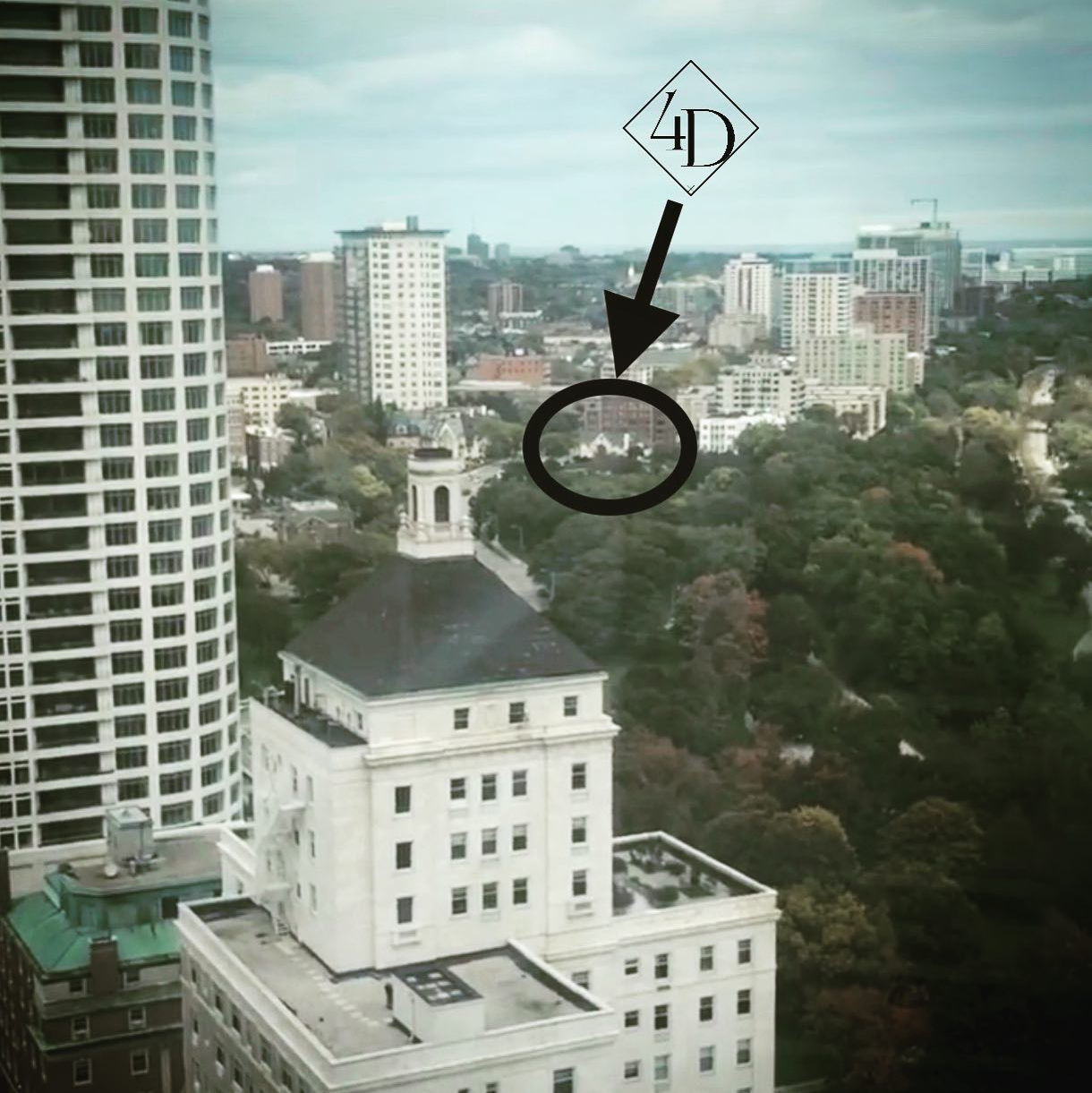 Cityscape view with a building encircled and labeled 