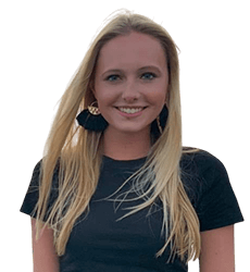 A woman with long blonde hair is wearing a black shirt and earrings.