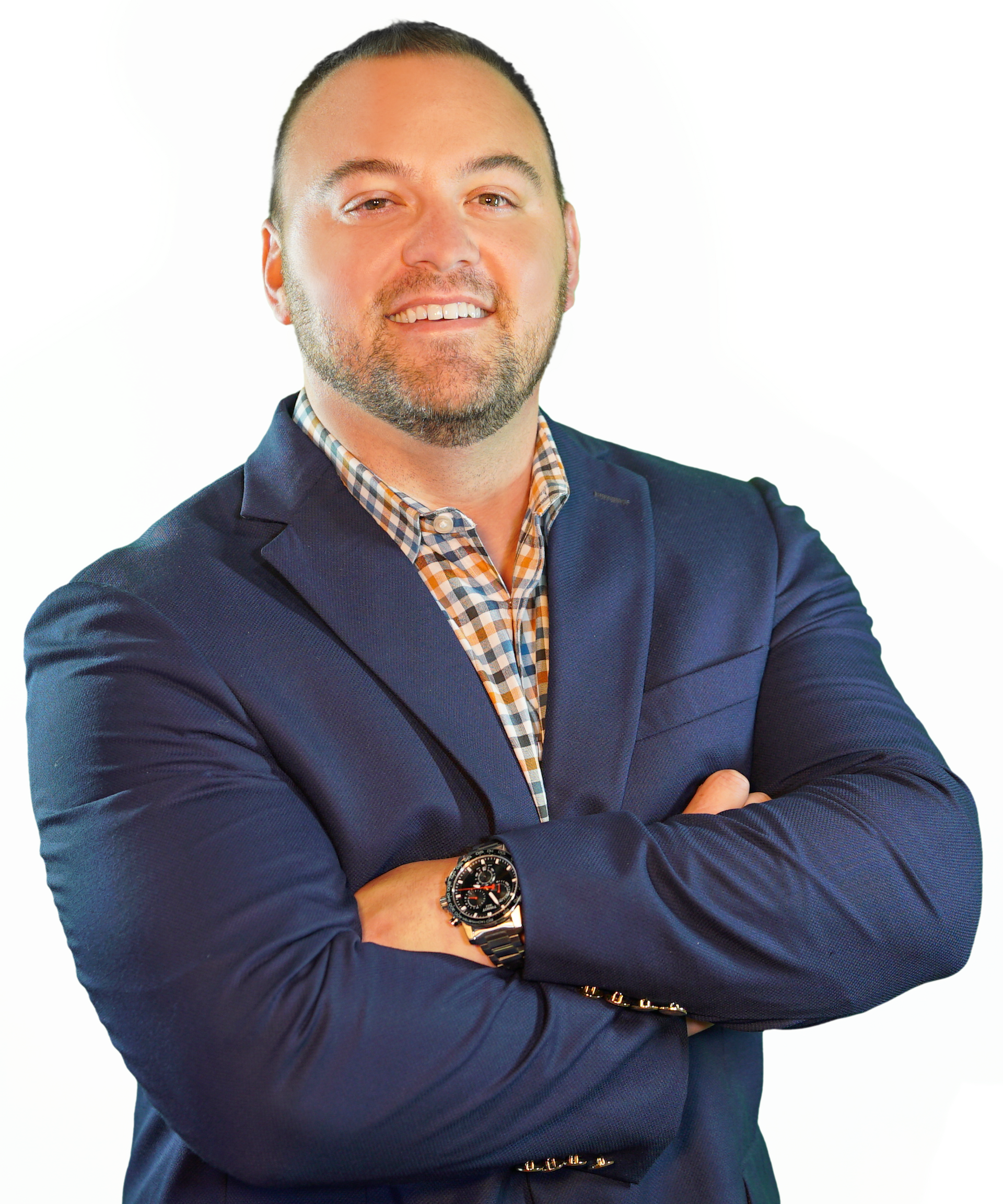 A man in a suit and plaid shirt with his arms crossed