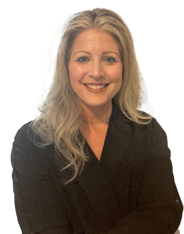 A woman in a black jacket is smiling with her arms crossed.