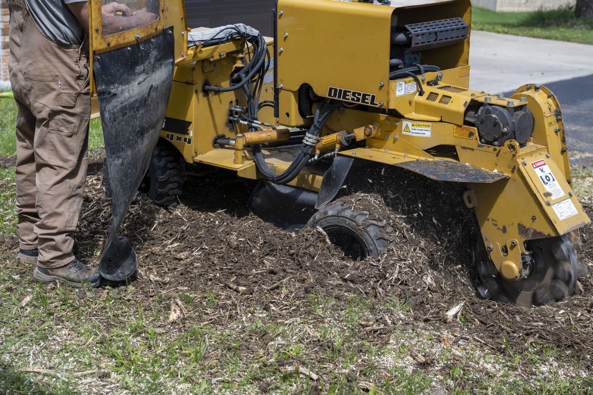 SYS Enterprises team performing stump grinding and removal in Charlestown, Indiana