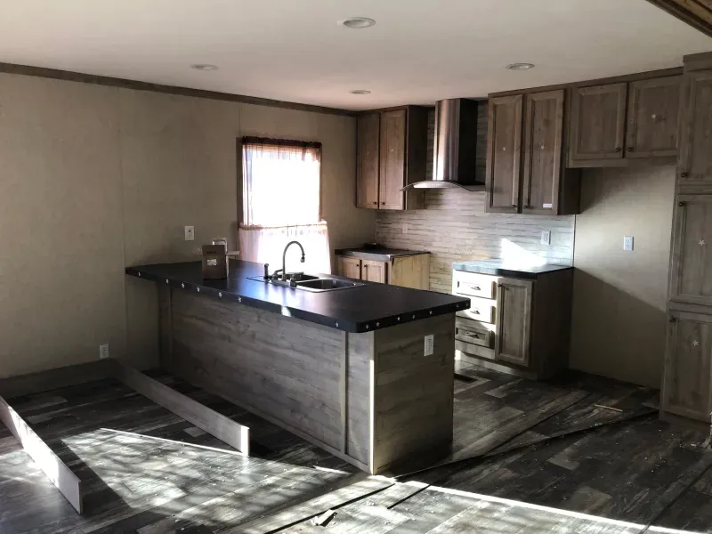 A kitchen with a large island in the middle of the room.