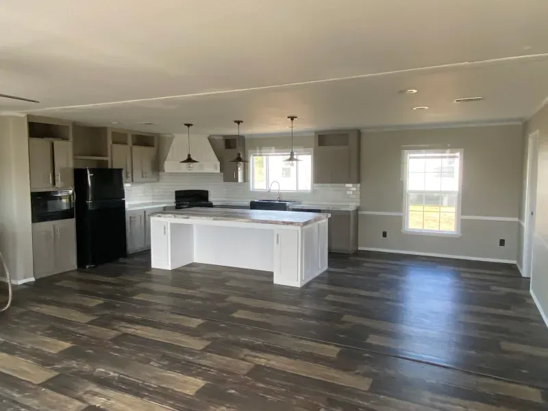 A kitchen with a large island in the middle of the room.