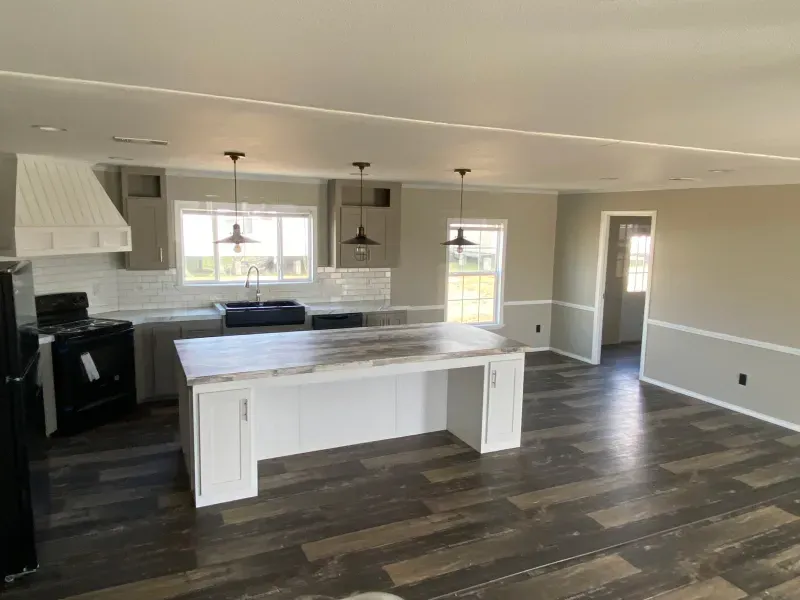 A kitchen with a large island in the middle of it