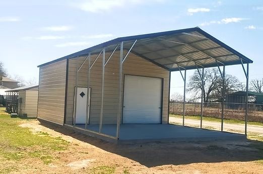 A garage with a canopy over it and a door.