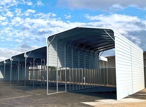 A large white building with a blue sky in the background.