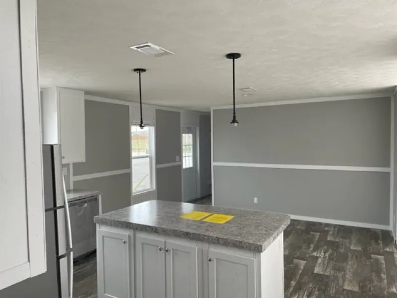 There is a large island in the middle of the kitchen.