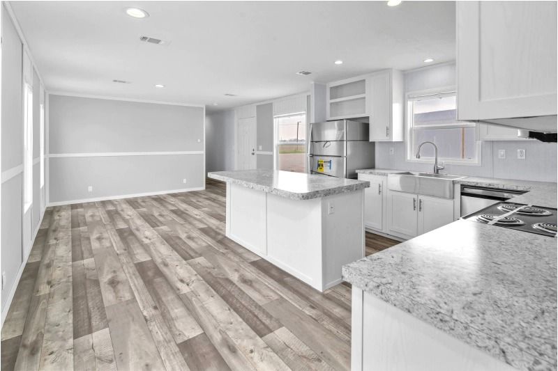 A kitchen with a large island in the middle of the room.