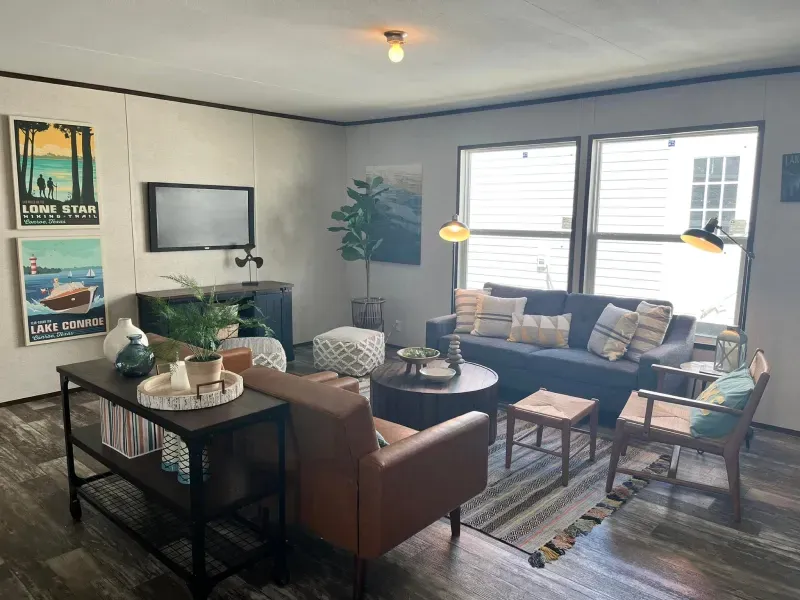 A living room filled with furniture and a television.
