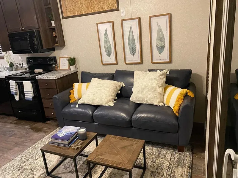 There is a couch and two coffee tables in the living room.