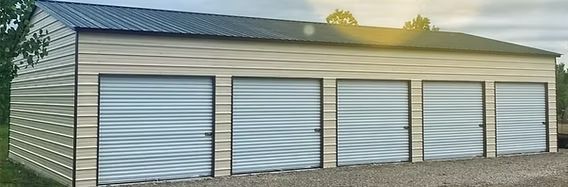 A garage with a lot of doors and a roof.