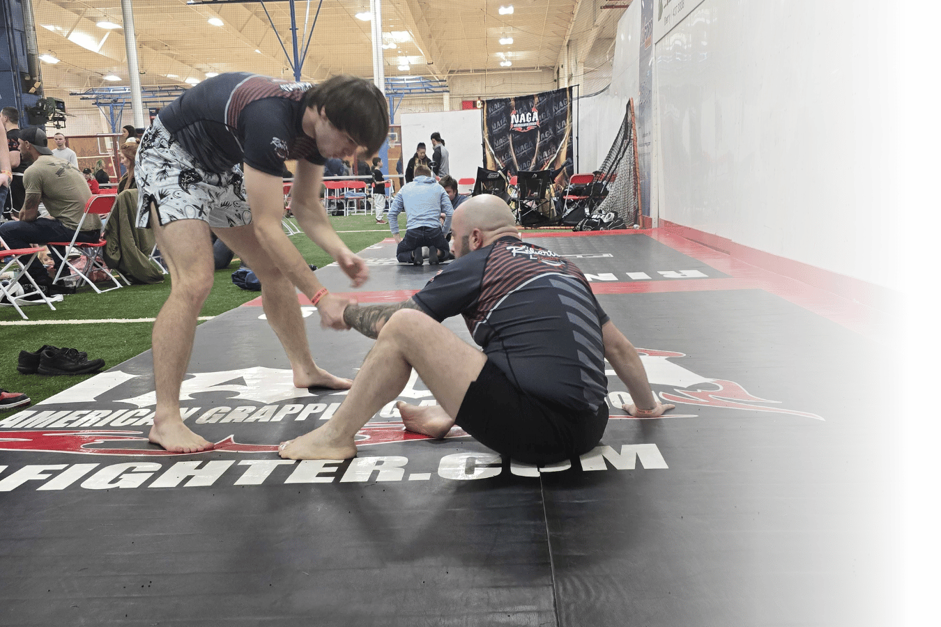 Students practicing jiu jitsu drills at Roberts Family Mixed Martial Arts in Orange, MA, building fitness and friendship