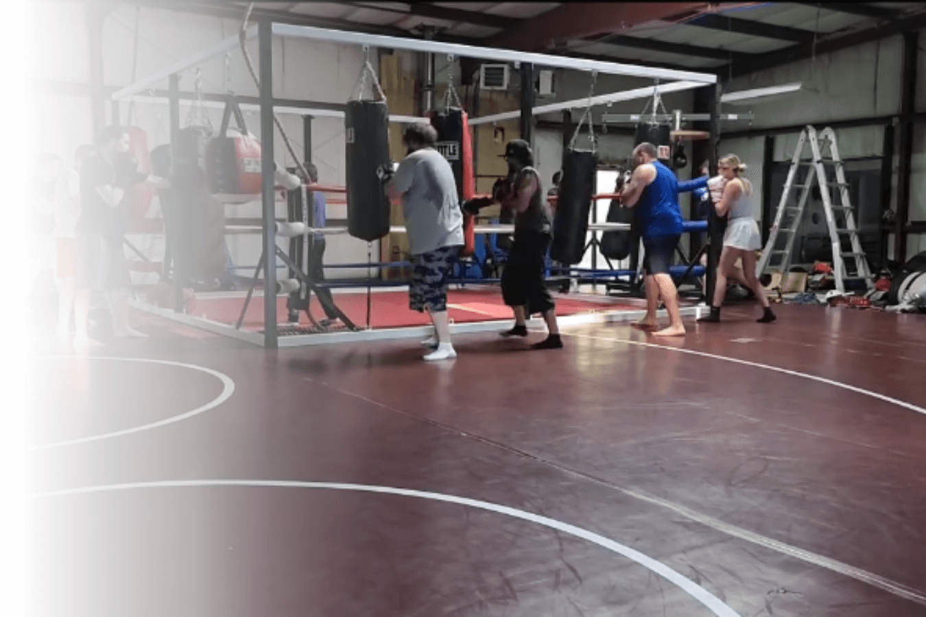 Adults drilling jiu jitsu techniques at Roberts Family Mixed Martial Arts in Orange, MA to build focus daily.