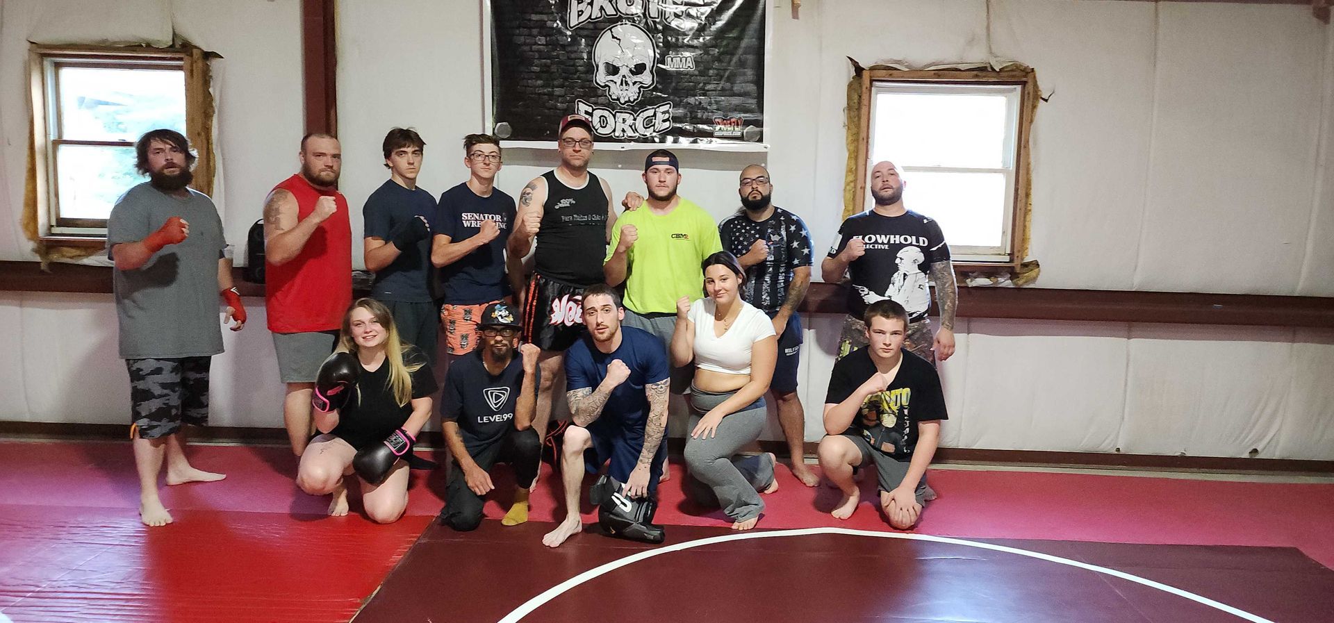 Adults and kids practicing jiu jitsu drills at Roberts Family Mixed Martial Arts in Orange, MA.