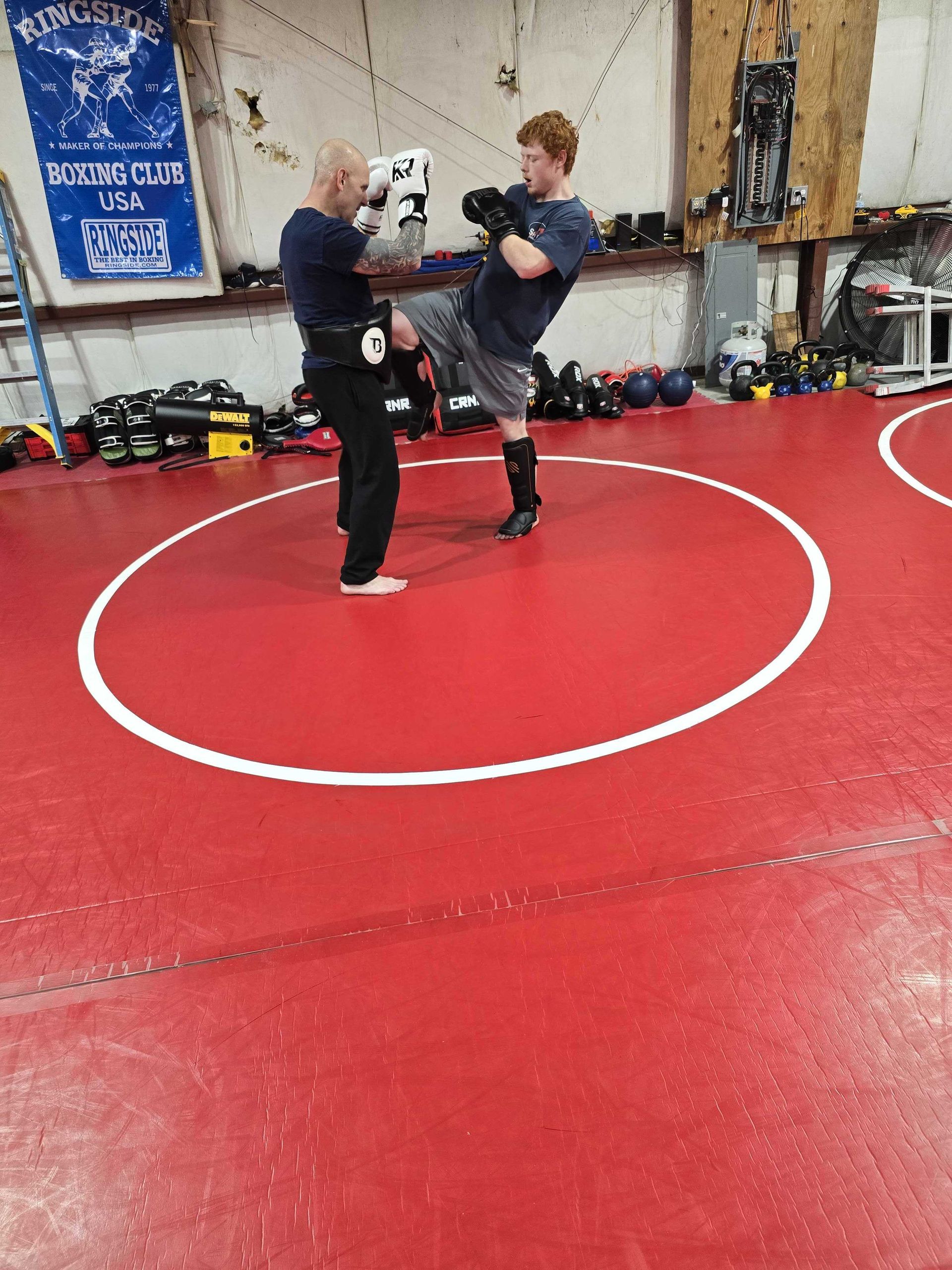 ids practicing controlled drills at Roberts Family Mixed Martial Arts in Orange, MA, building focus.