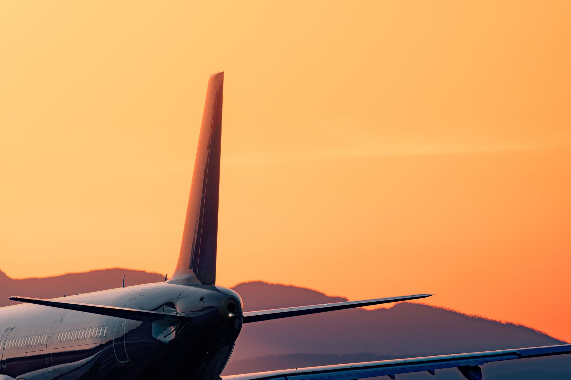 A man and a woman are boarding a private jet.