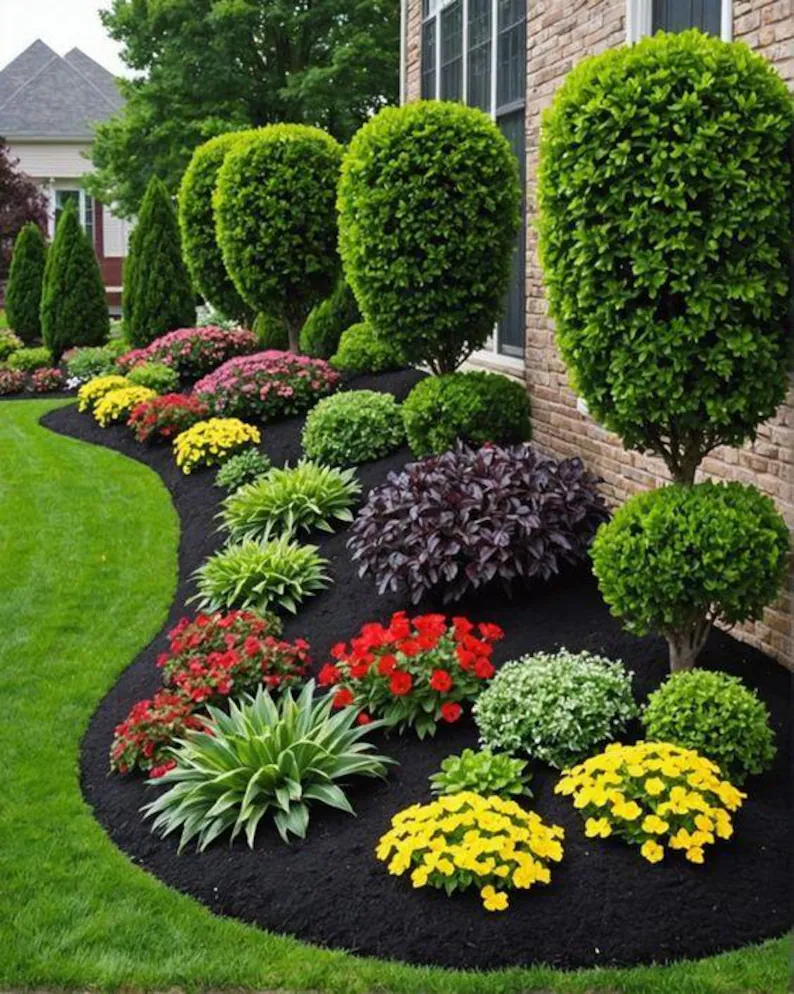 A stone walkway leading to a house in a lush green yard.