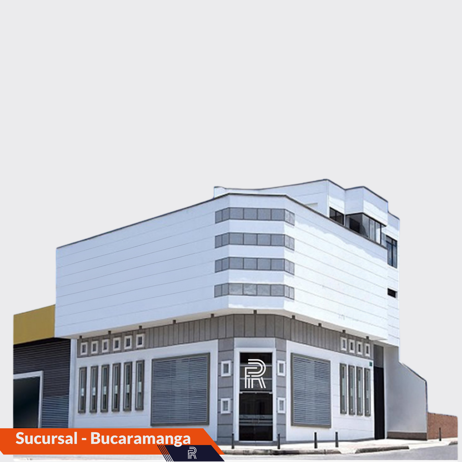 Edificio en Bucaramanga con fachada gris y blanca y contraventanas cerradas.