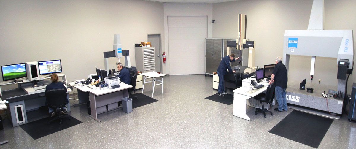 A People Are Sitting In A Room With Computers — New Berlin, WI — Quality Calibration Services