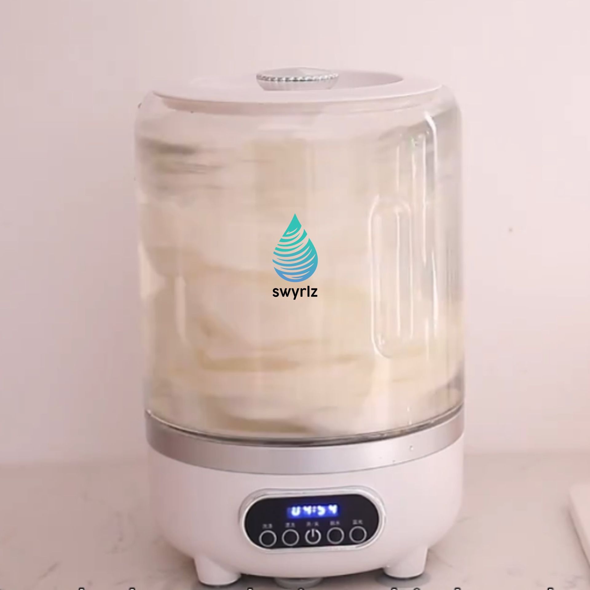 White appliance with a glass top. Interior filled with white material. Controls on the front.