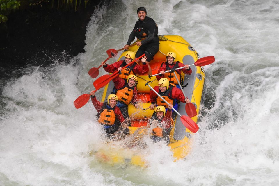 A group of people are riding a raft down a river.