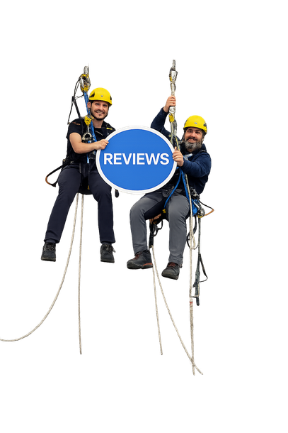 A construction worker in a blue uniform and yellow hard hat standing with arms crossed against a white background.